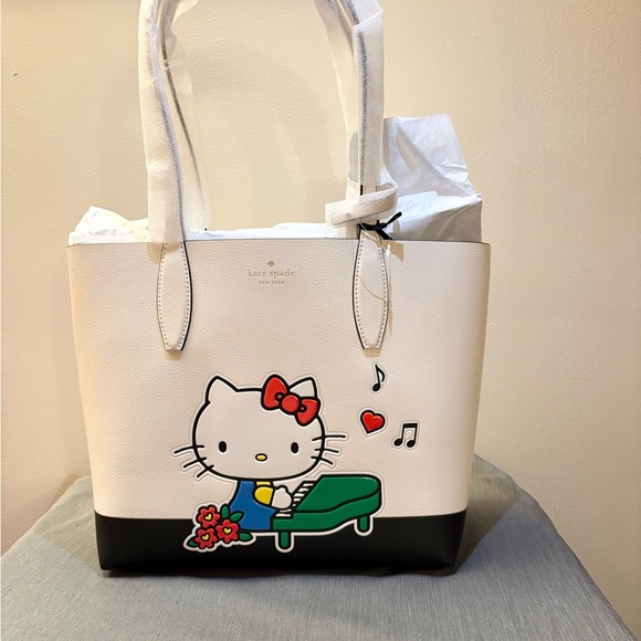kate spade Handbags - Kate Spade Cream and Black Hello Kitty Tote
